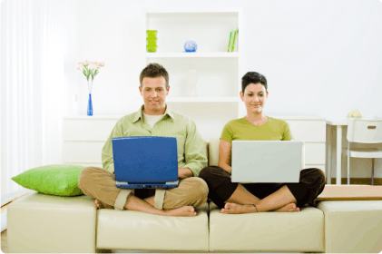 Couple working on sofa